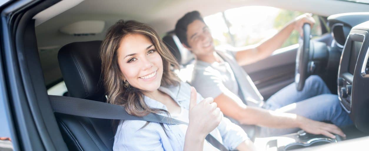 Happy couple going on a road trip